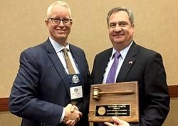 The new MARS President Harry Zander (left) is congratulated by outgoing president Michael Barth, who was honored for his leadership at the 2018 Winter Meeting in January.