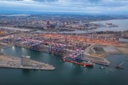 A ship delivers new ship-to-shore gantry cranes to Long Beach Container Terminal in the Port of Long Beach. 