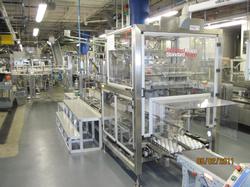 New bottle packer increases speed/reduces glass breakage for distilled spirits maker