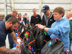 American Crane and Equipment Corporation pays holiday cheer forward