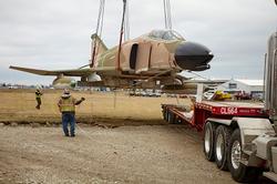 Dawes Crane moves memorial phantom F-4 jet fighter