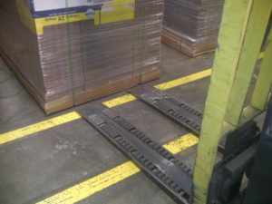 Handle slip-sheeted loads and pallets with the same forks