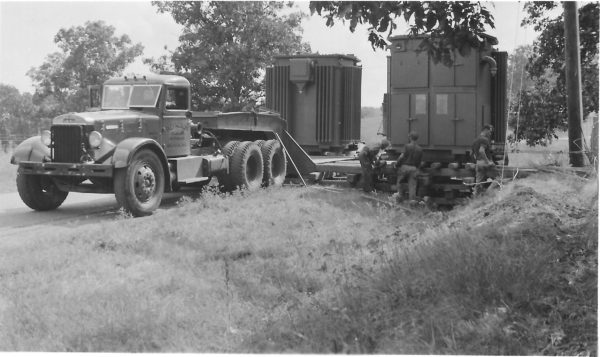Here, a 66,000-lb. load is moved by wood rollers. Reynolds Transfer and Storage still has the tractor unit (circa. 1940).vvvvv