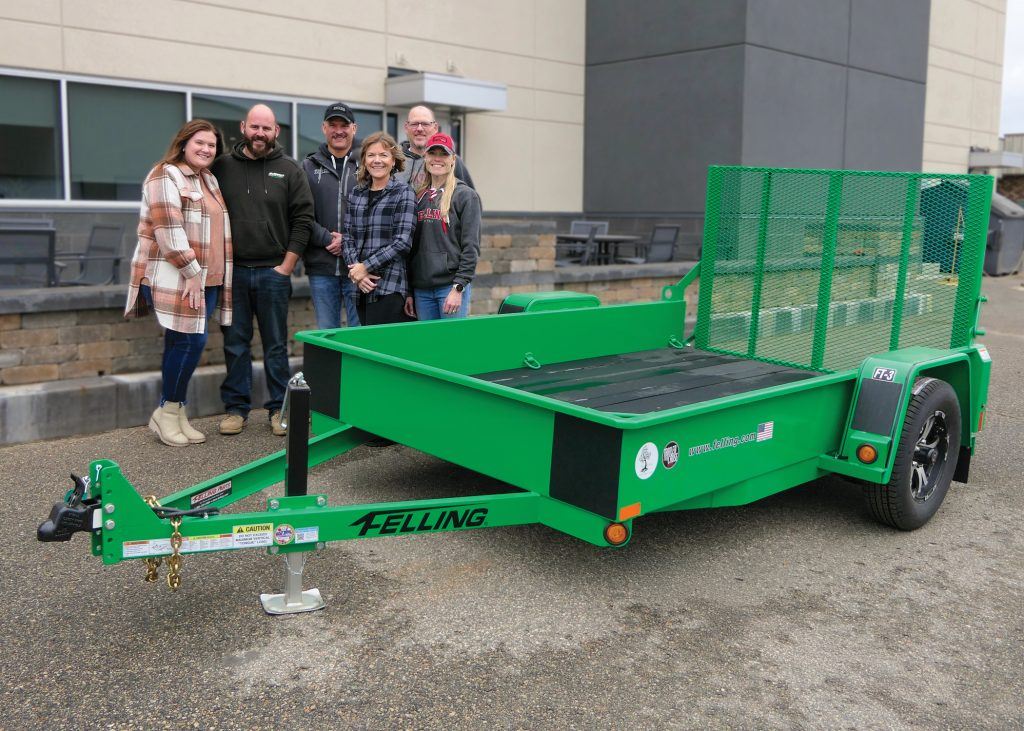 2025 Trailer for a Cause FT-3 utility trailer (l-R): Auction winners Jess & Alex Hoffman. Felling Trailers owners Paul & Bonnie Radjenovich, Brenda & Patrick Jennissen. image