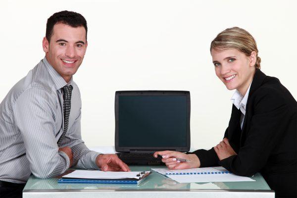 Man and woman working on an agreement image