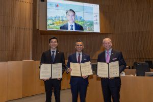 Photo caption: A delegation from the Maritime and Port Authority of Singapore (MPA) visited the Bob Foster Civic Chambers at the Long Beach Civic Center on March 20 to sign a three-year extension of the Green and Digital Shipping Corridor partnership between the Port of Singapore, the Port of Long Beach and the Port of Los Angeles. In the foreground, from left: Chin Yi Zhuan, Deputy Chief Executive, MPA; Port of Long Beach CEO Dr. Noel Hacegaba and Port of Los Angeles Executive Director Gene Seroka. On the screen is MPA CEO Ang Wee Keong.